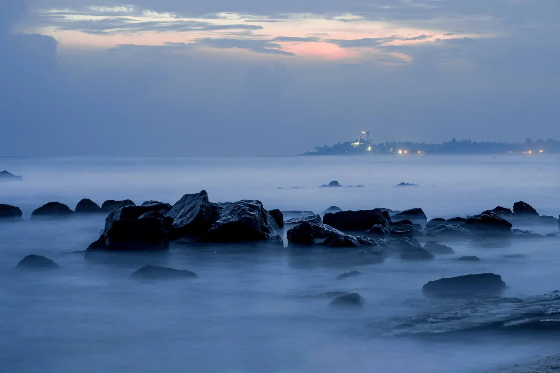 Rocks and reef off Madiha at dusk