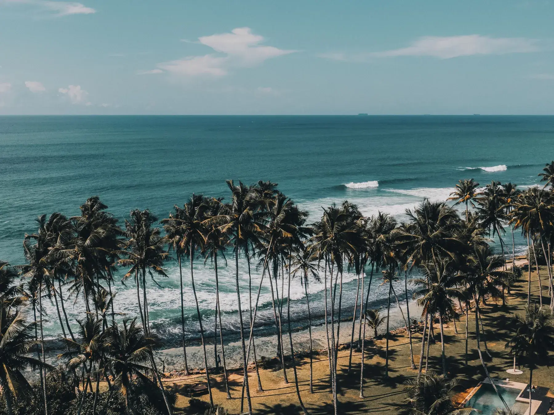 Palm-lined beach and turquoise sea near Matara