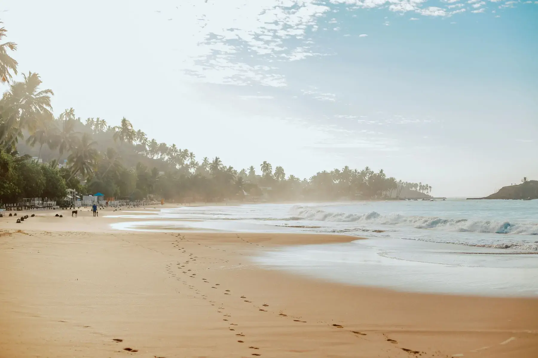 Footprints along the empty beach at Mirissa in the early morning